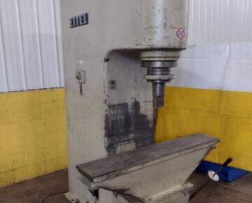 A well-used legacy model Eitel manual straightening press sits against a white and yellow background.