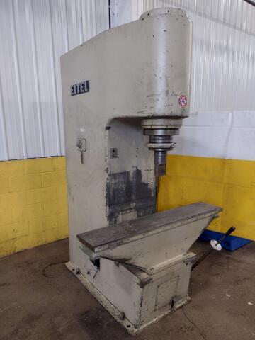 A well-used legacy model Eitel manual straightening press sits against a white and yellow background.